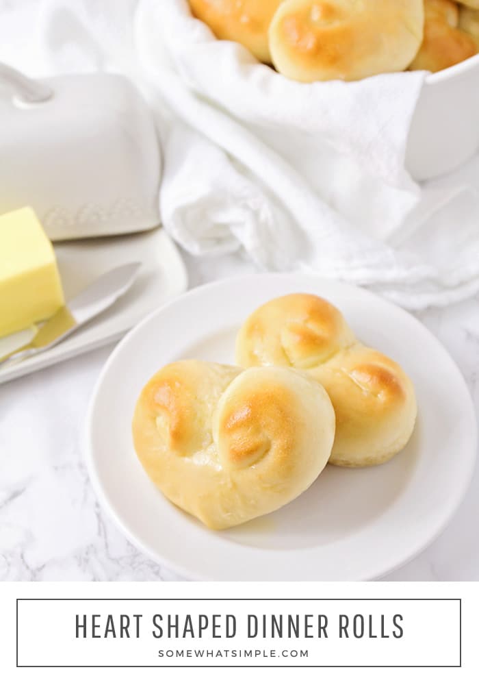 These heart shaped dinner rolls are a fun addition to any romantic homemade dinner.  In just a few simple steps you can transform what would be ordinary bread into a heart shaped masterpiece.  Whether it's Valentine's Day your anniversary or any other special occasion, this bread is perfect for that special dinner. via @somewhatsimple